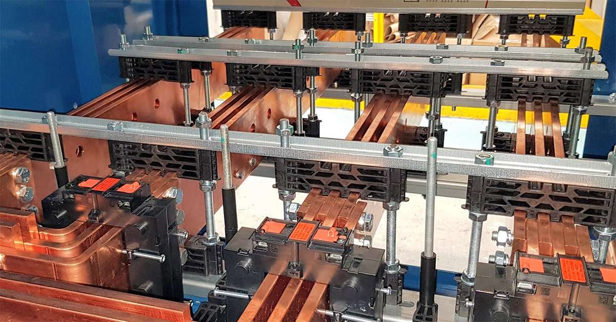 Busbar Supports clamped around busbars in Low Voltage Switchgear and controlgear assembly
